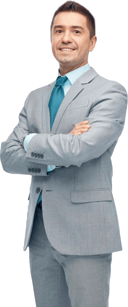 Man wearing a gray suit and blue tie, standing with arms crossed and smiling.